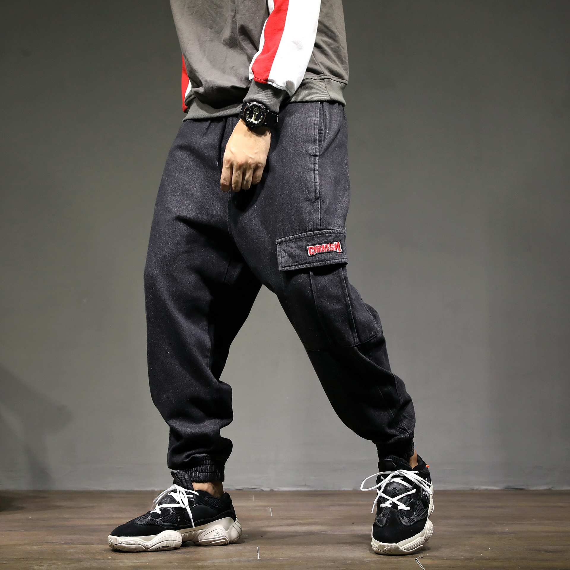 春季男士新款休闲日系潮牌哈伦束脚牛仔裤宽松加大码黑色牛仔长裤