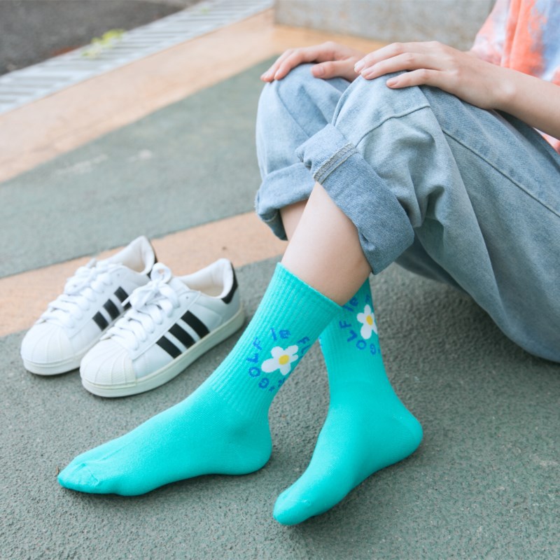 新品golf经典小花花三色全棉运动中筒袜子男女情侣滑板袜