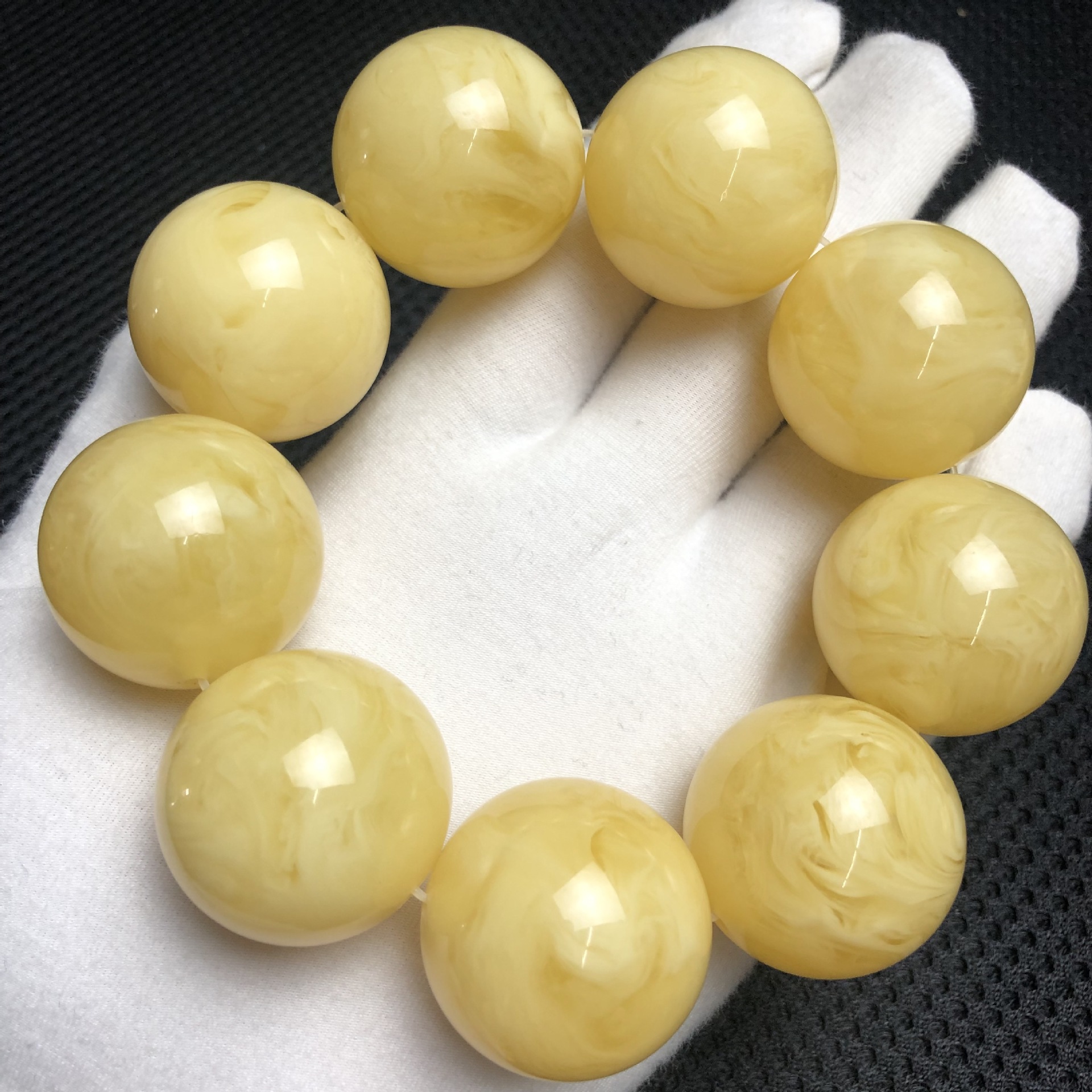 二代蜜蜡粉压合成蜜蜡俄料单圈手串厂家直销浮盐水有荧光直播货源