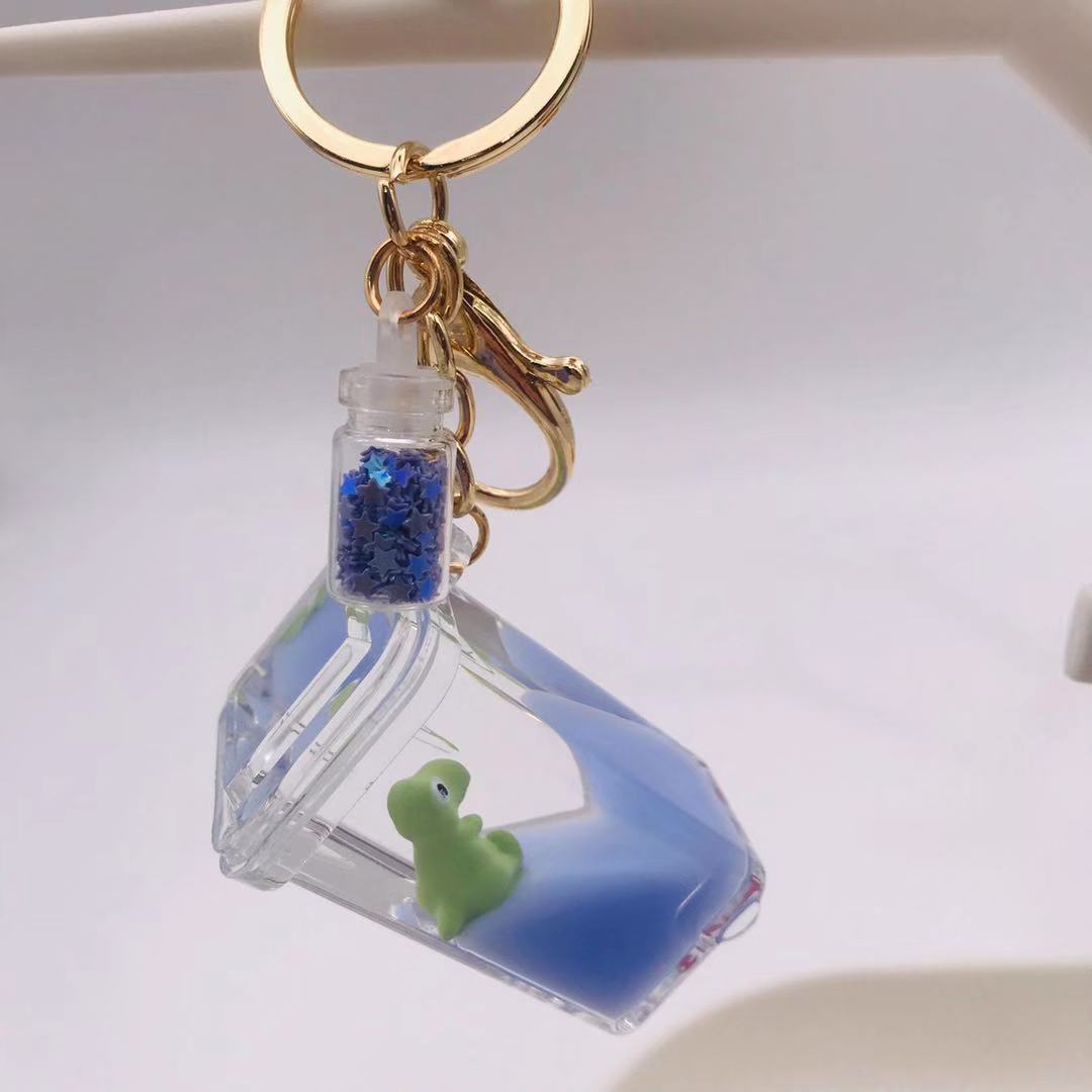创意入油流沙牛奶瓶海洋恐龙钥匙扣亚克力亮片漂浮瓶包包汽车挂件