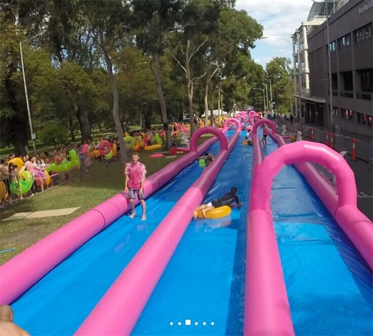 大型充气滑道旱地滑道城市水滑道趣味运动道具超长滑梯游乐场定制