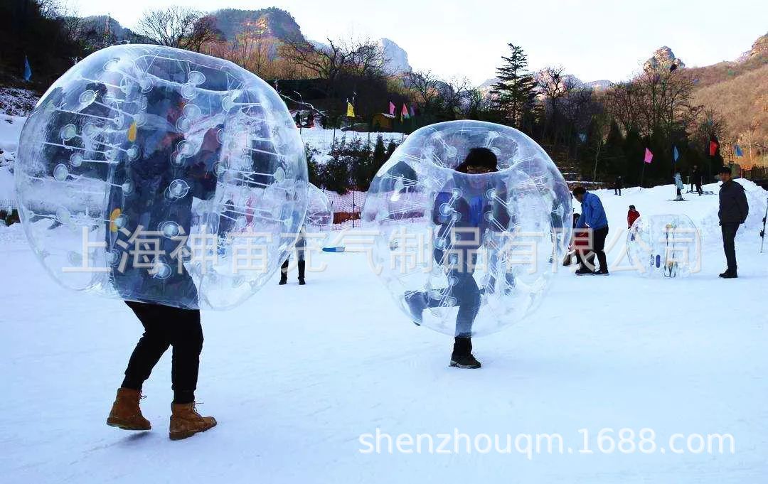 雪地玩具设备冬季运动会娱乐设施充气碰碰球皮划艇透明滚球保龄球