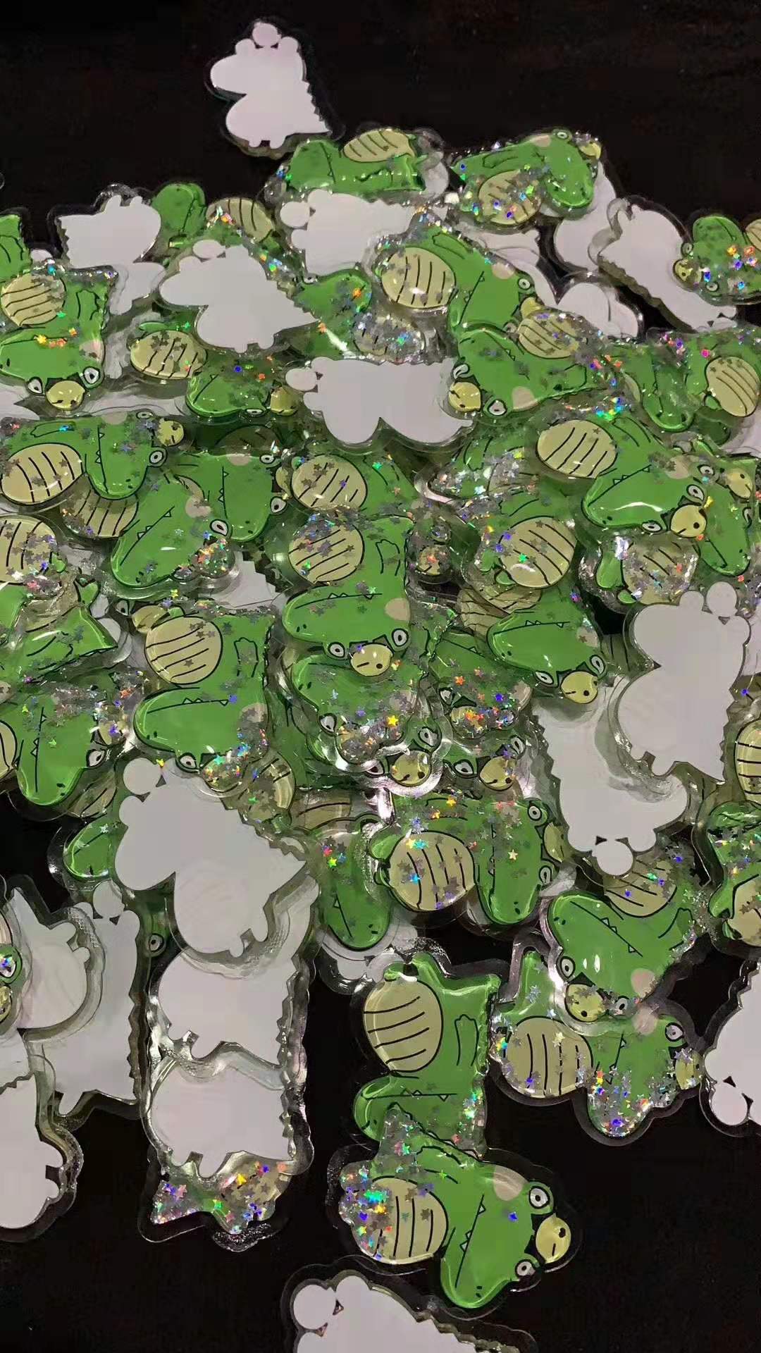 跨境创意新款闪粉漂浮入油液体流沙卡通油包手机支架装饰背贴配件