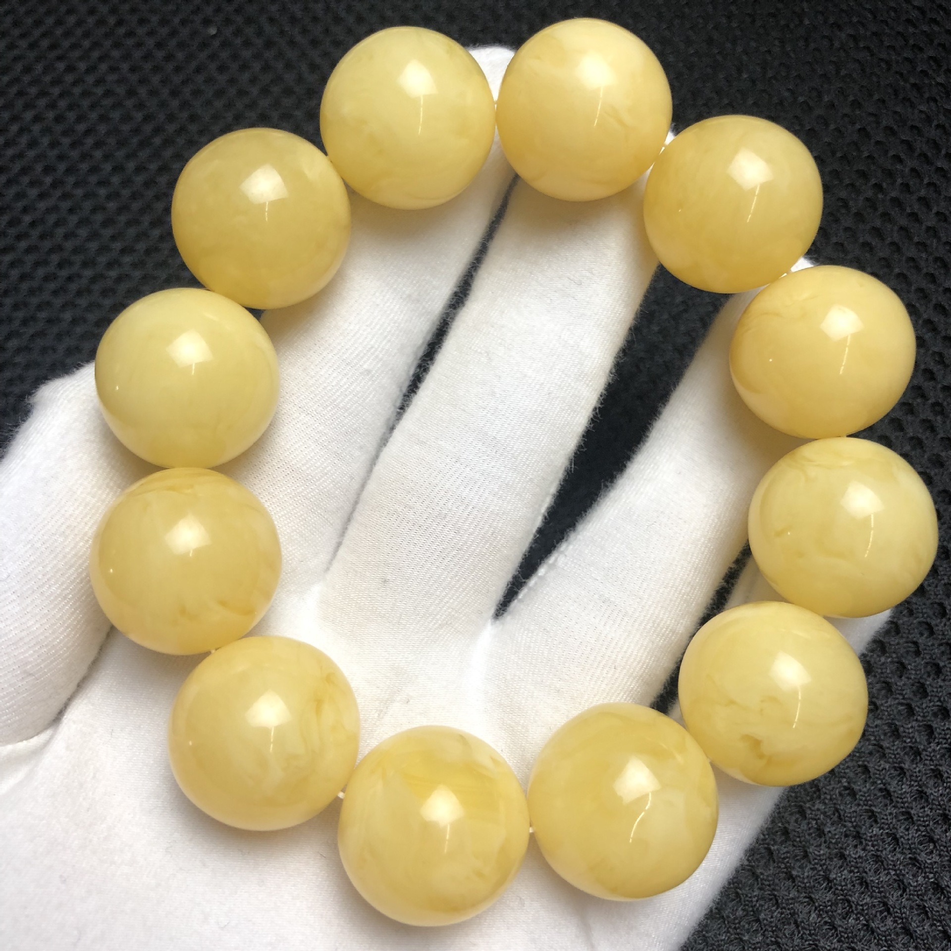 二代蜜蜡粉压合成蜜蜡俄料单圈手串厂家直销浮盐水有荧光直播货源