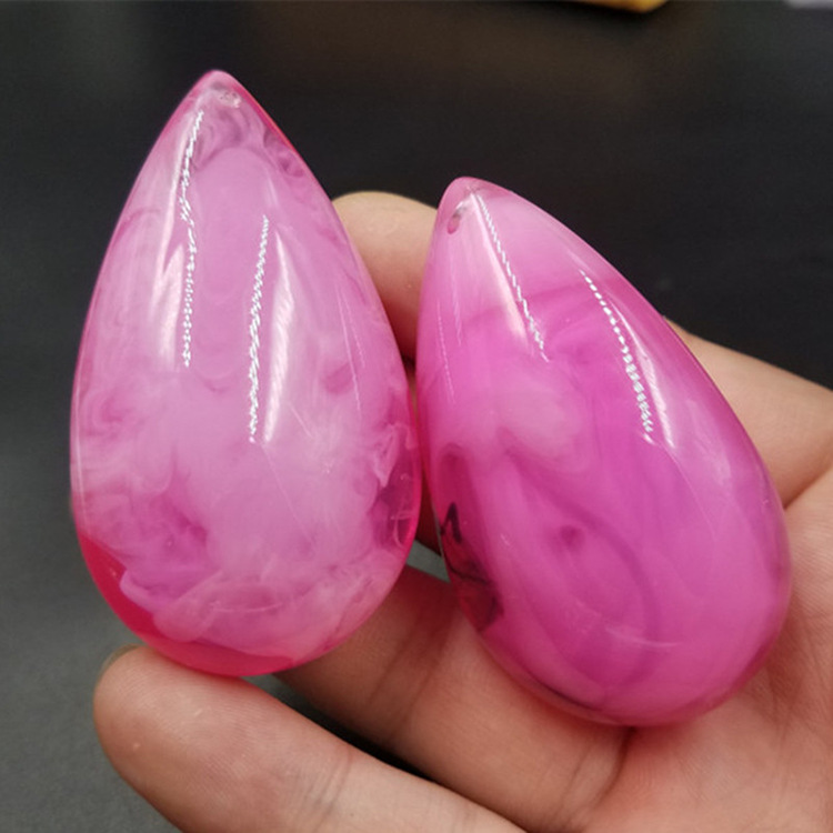 仿蜜蜡水滴挂件荧光浮盐水粉色蜜蜡水滴挂件蜜蜡毛衣坠