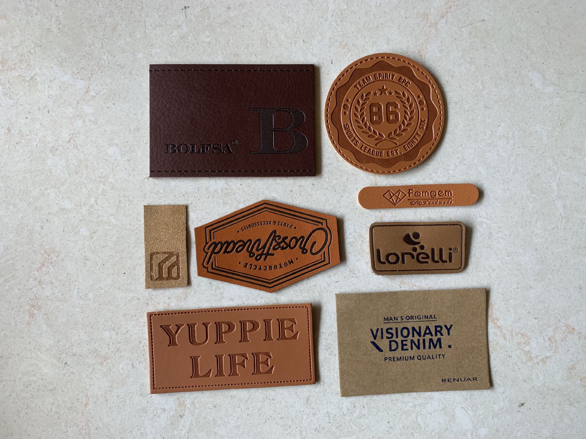 厂家直销真皮皮牌 pu变色皮标定做 订制牛皮纸洗水标金属皮标定制