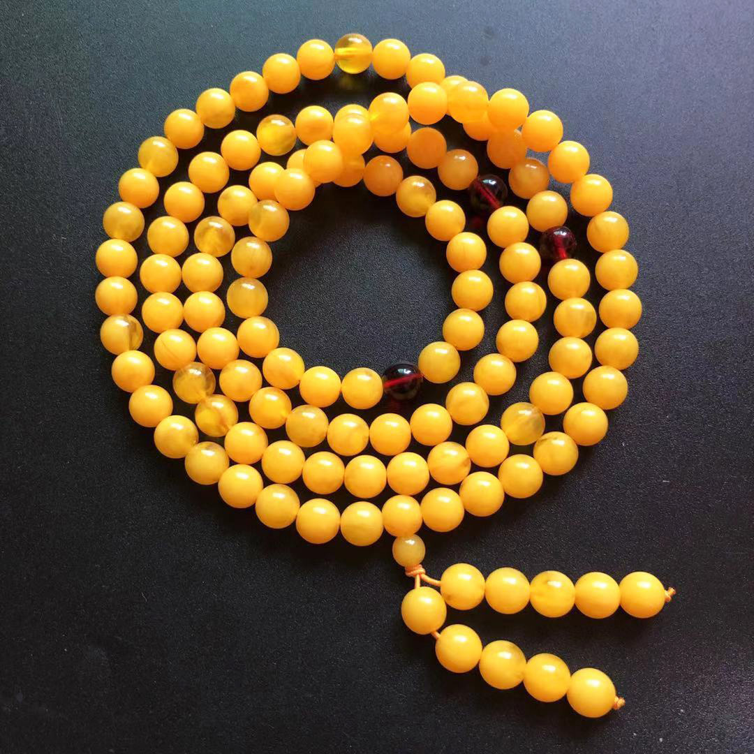 厂家二代蜜蜡浮盐水荧光108颗佛珠多圈鸡油黄飘花蜜蜡手链