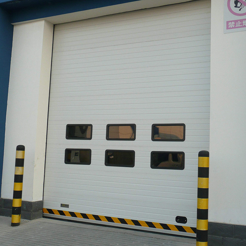 尚飞门业垂直工业翻板提升门仓库抗风滑升门电动翻板门支持定制