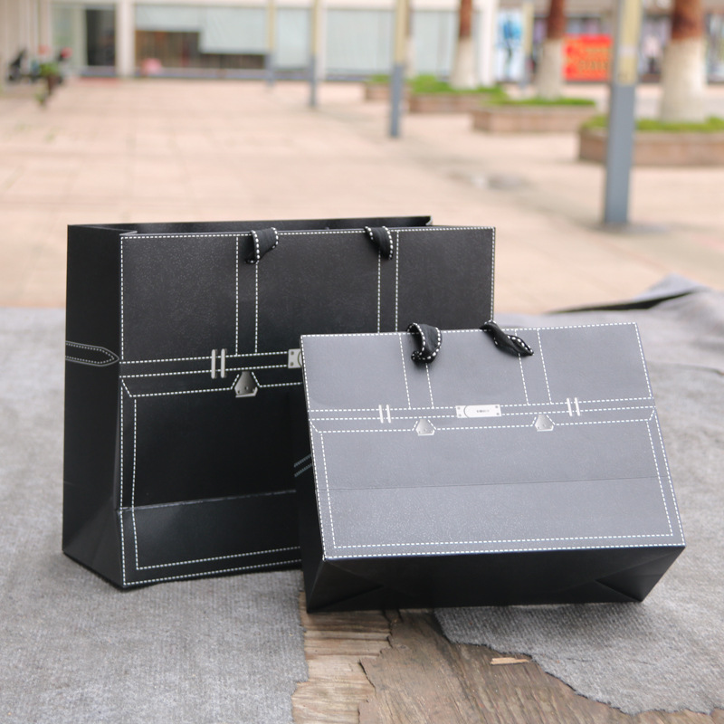 时尚服装店纸袋 覆膜黑色精美男装手提纸袋 可印logo购物礼品纸袋
