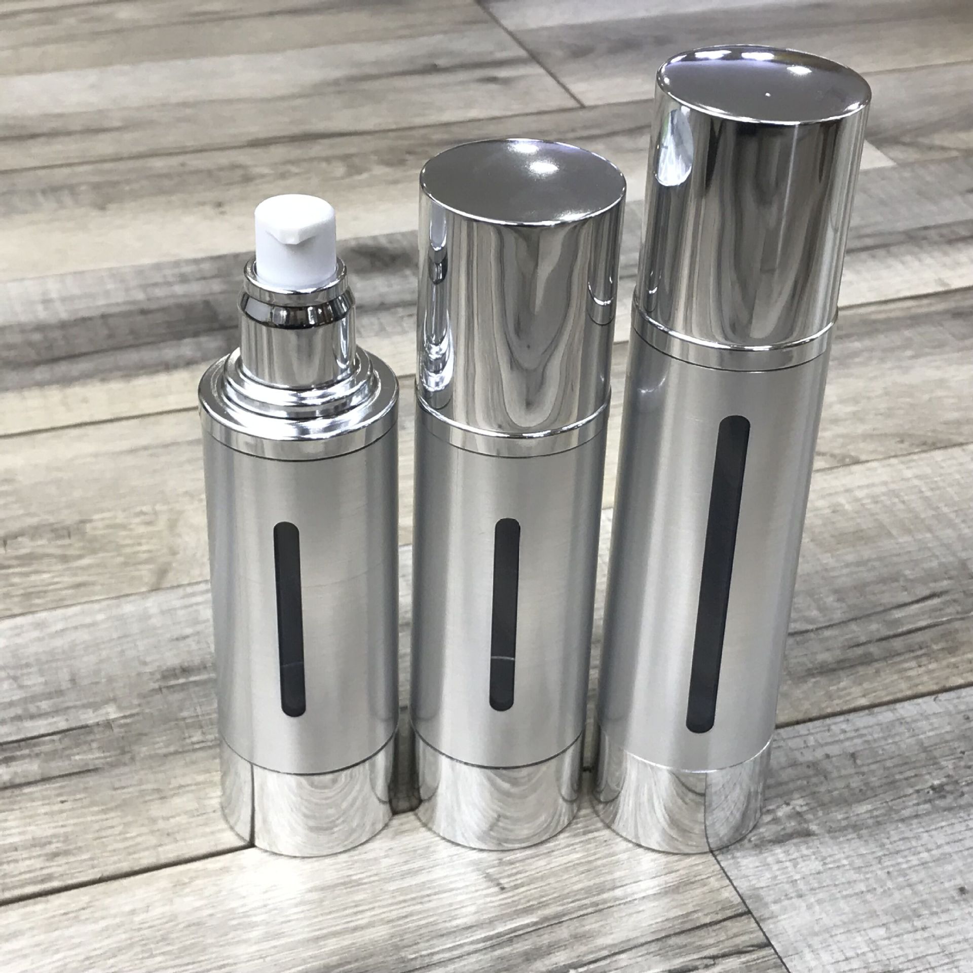 80ml100ml按压乳液真空瓶开窗 银色镂空真空瓶 厂家直销 定制工艺