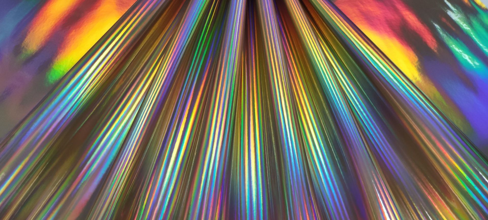 厂家直销 幻彩镭射镜面tpu高光亮面皮革箱包手包鞋材面料人造革