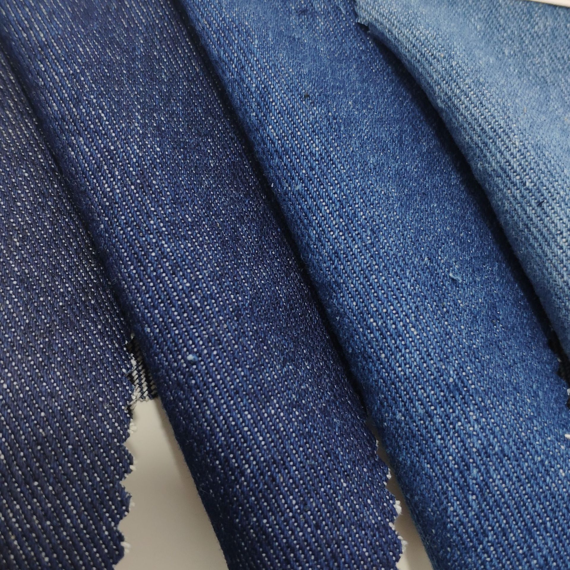 洗水牛仔布全棉1010左斜牛仔10oz外套裤装面料箱包鞋材