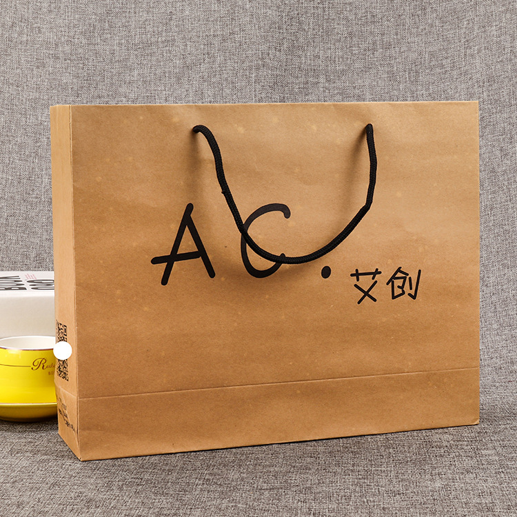 牛皮纸袋定做服装手提白卡纸广告购物袋礼品包装袋子印刷定制logo