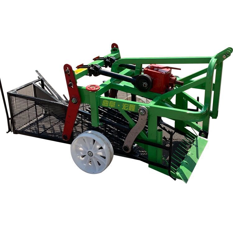 四轮带免捡果收花生机器 花生出土机花生收割机 河南起花生机图片