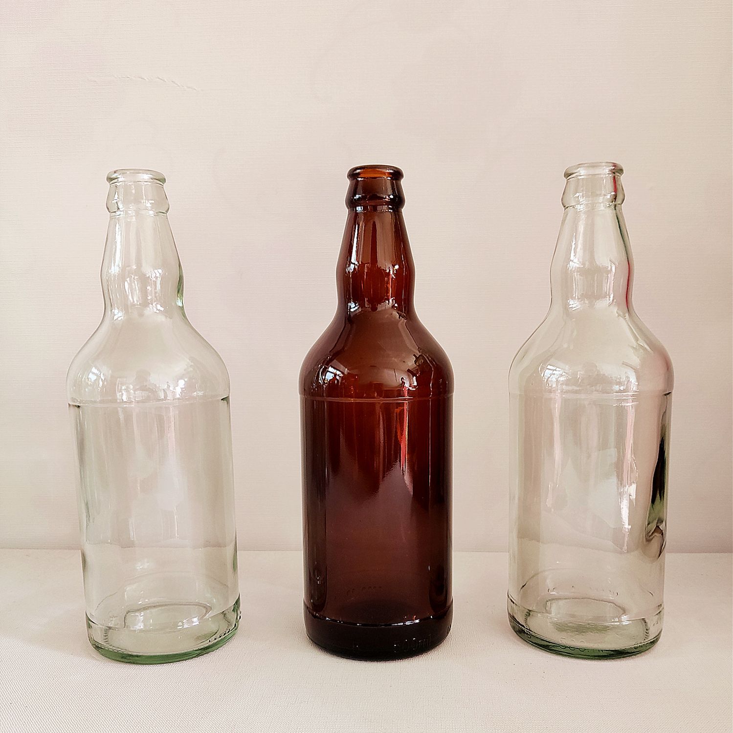 厂家批发全新玻璃啤酒瓶 500毫升透明玻璃酒瓶 皇冠盖透明啤酒瓶-阿里