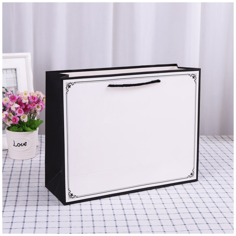 简约服装纸袋定做 商场礼品袋外卖购物袋白卡纸手提袋定制印logo