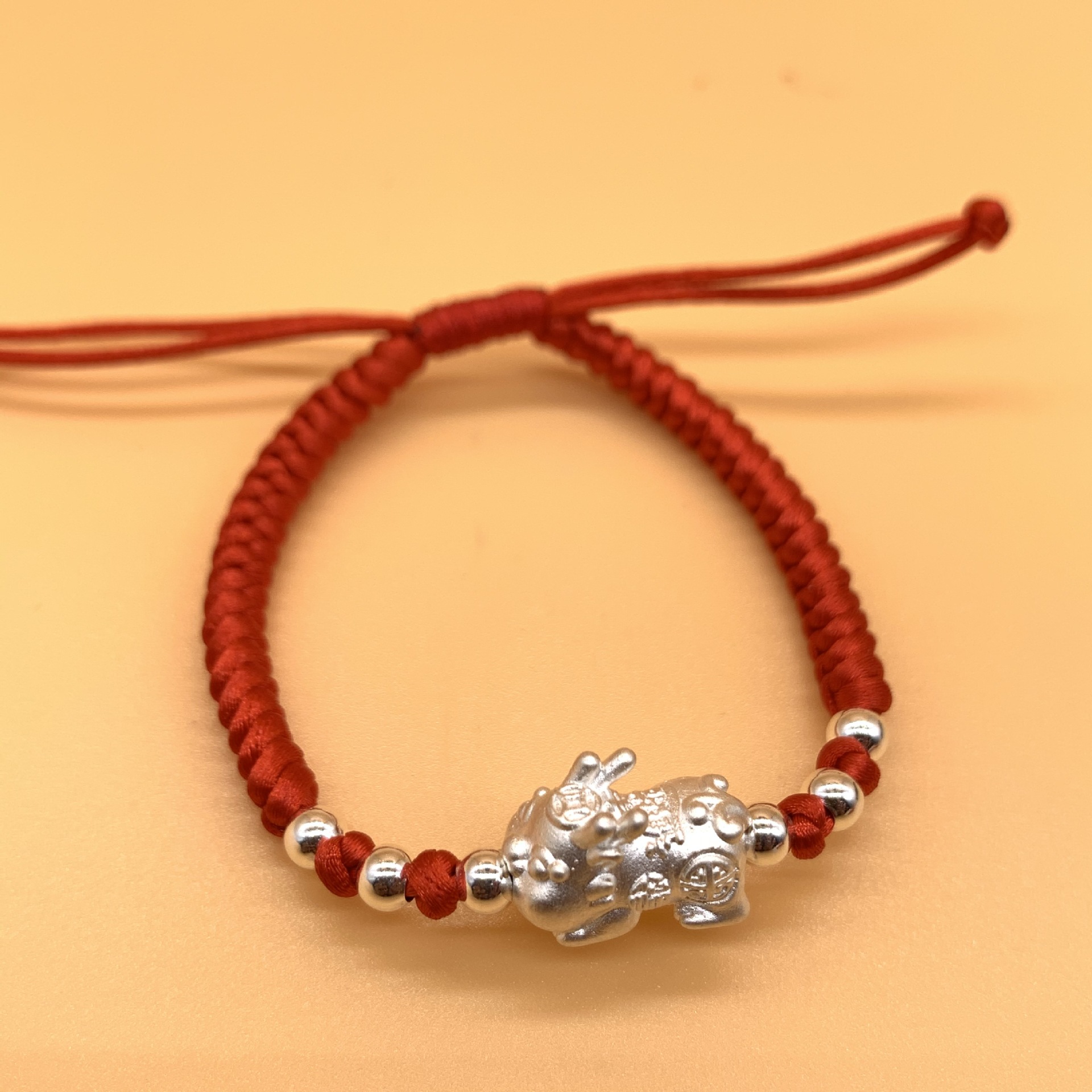 999银硬银萌萌貔貅手链 0.5克 情侣 宝宝小孩子红绳手串手工编织