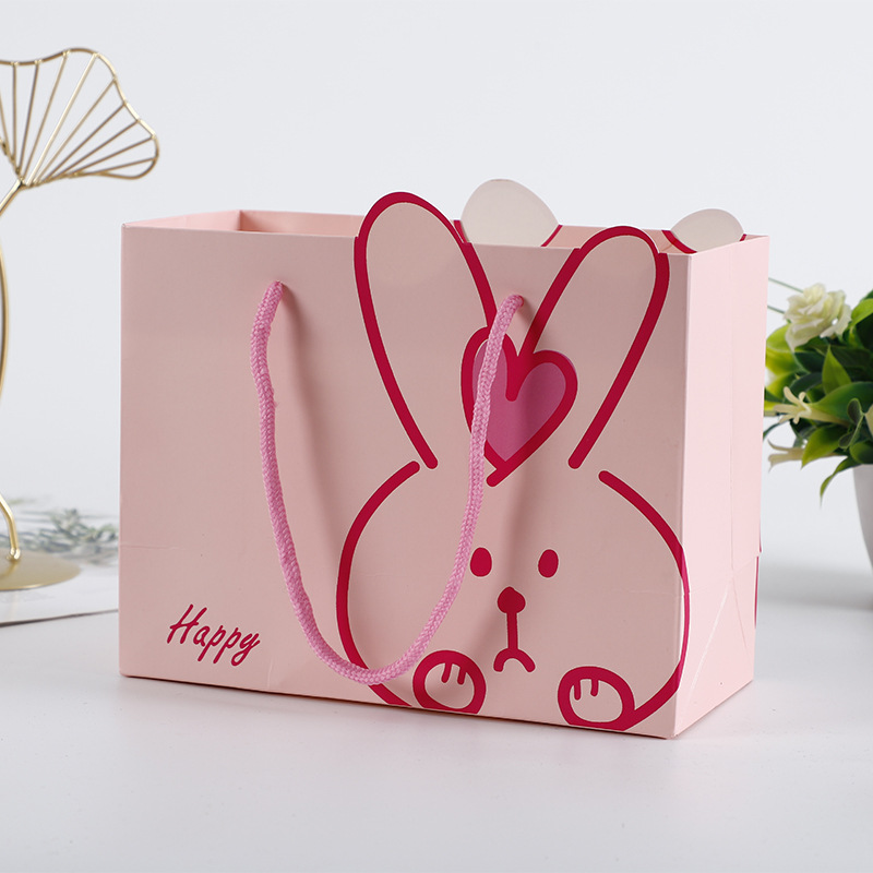 厂家直销礼品纸袋可爱卡通兔子异形手提白卡纸购物袋广告手提袋