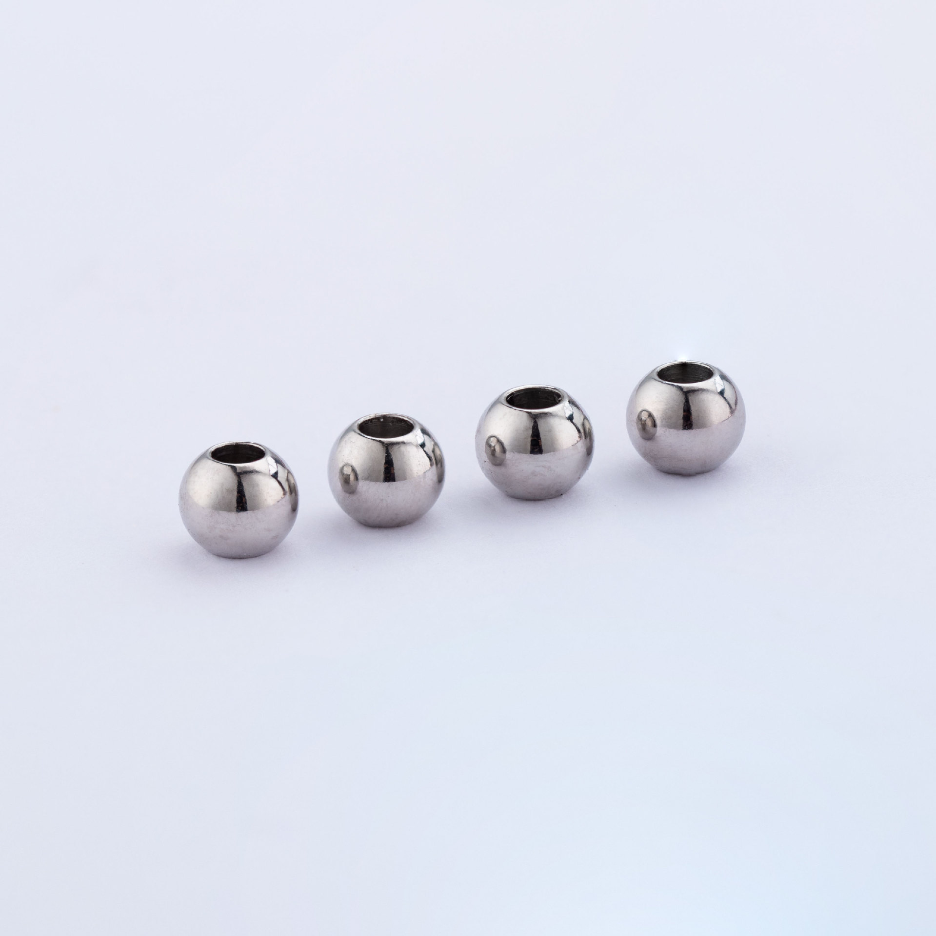 厂家直销加工定制316打孔钢珠304不锈钢穿孔球直径6mm2.5mm孔径