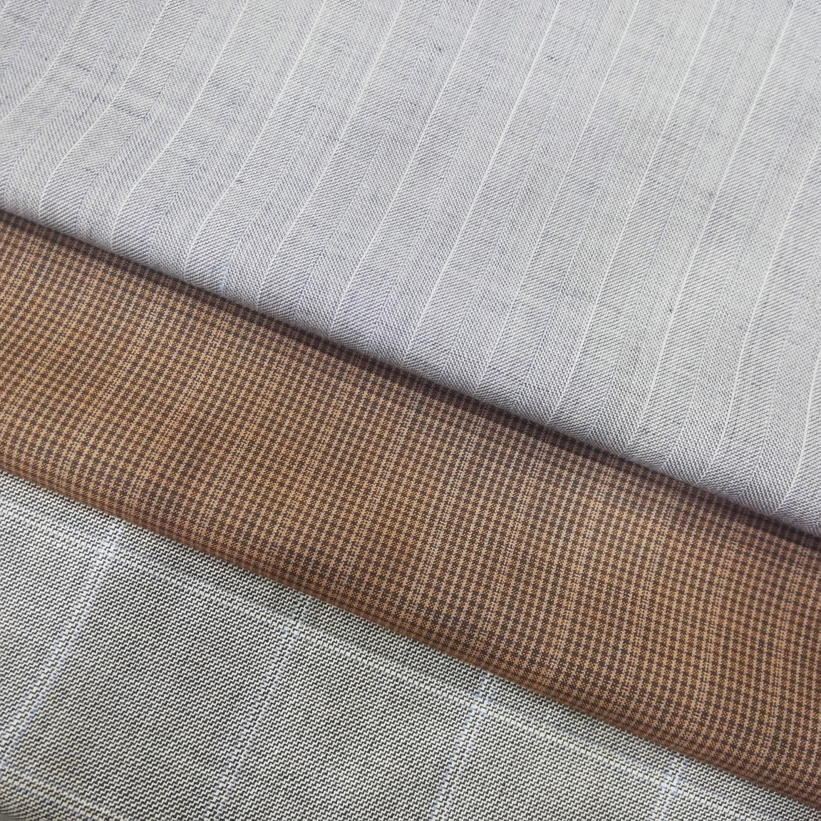 人字呢条纹板丝呢格精纺西裤面料羊毛天丝混纺面料莱赛尔新型纤维