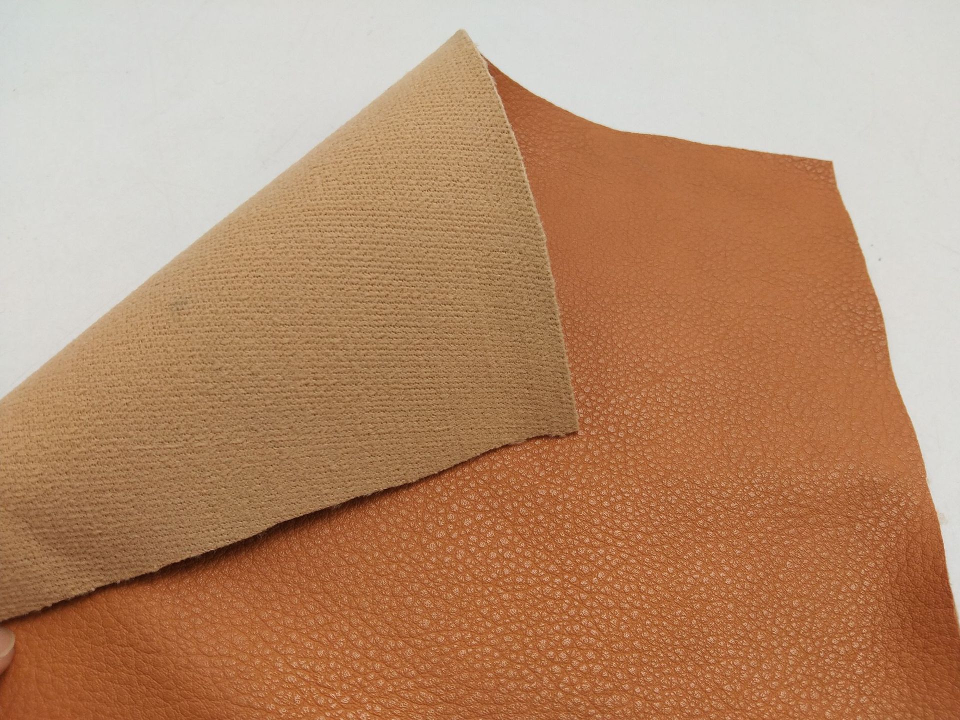 批发pvc人造革服装皮裙箱包皮革皮料1.0mm皮革面料厂家荔枝纹皮革