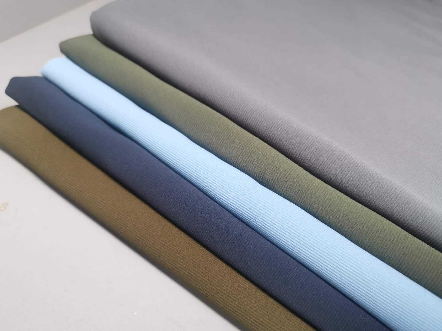 运动外套面料提花密鲁条风衣夹克休闲服针织布 秋冬运动裤子面料