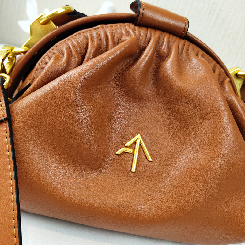 土耳其箭头manuatelier包包2021新款云朵褶皱贝壳真皮女包斜挎包