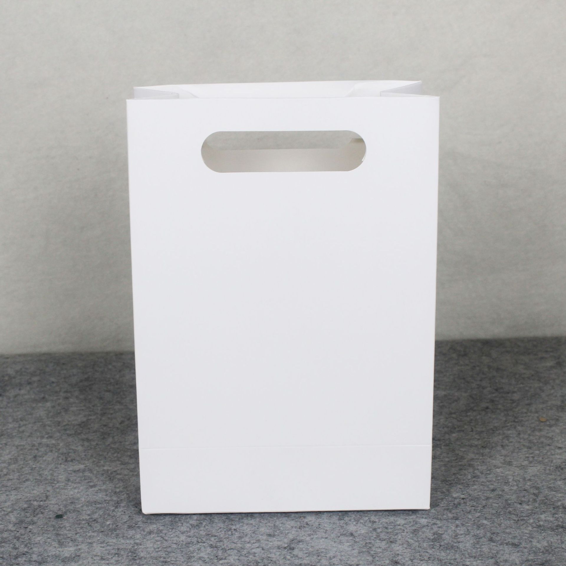 挖孔礼品袋无绳子纸袋加厚牛皮纸袋镂空纸袋小号化妆品展会文件袋