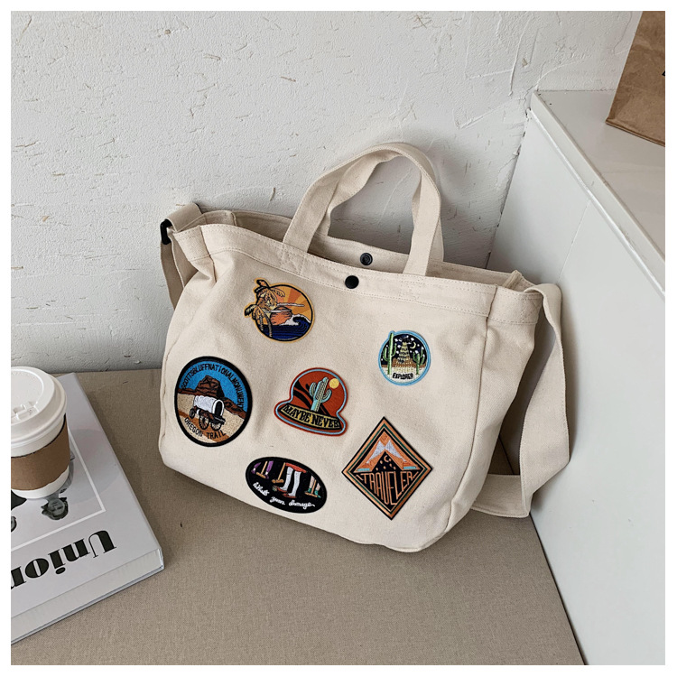 帆布包新款休闲刺绣徽章布标潮流时尚耐磨大容量单肩斜挎女包布包