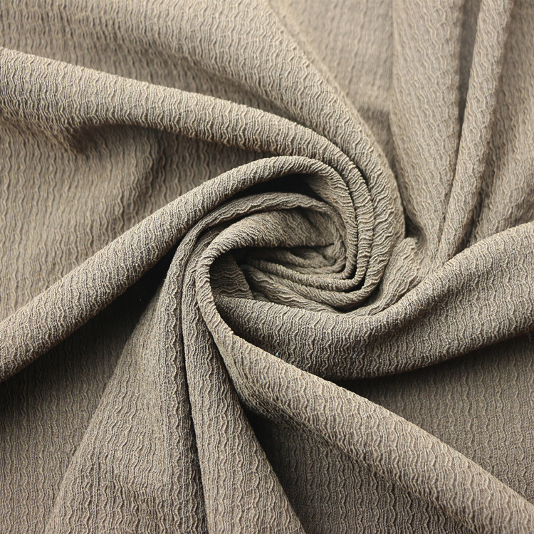 经编涤纶氨纶弹力针织提花凹凸泡泡纱绉布褶皱布时装女装童装面料