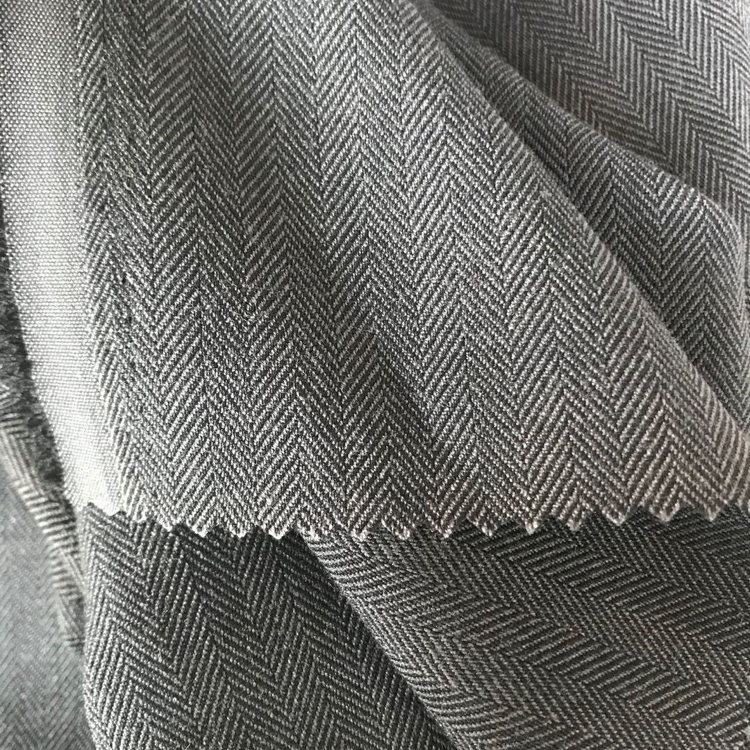 厂家直销 32s/2涤粘交织人字形tr纬弹面料 230g长裤风衣外套布料