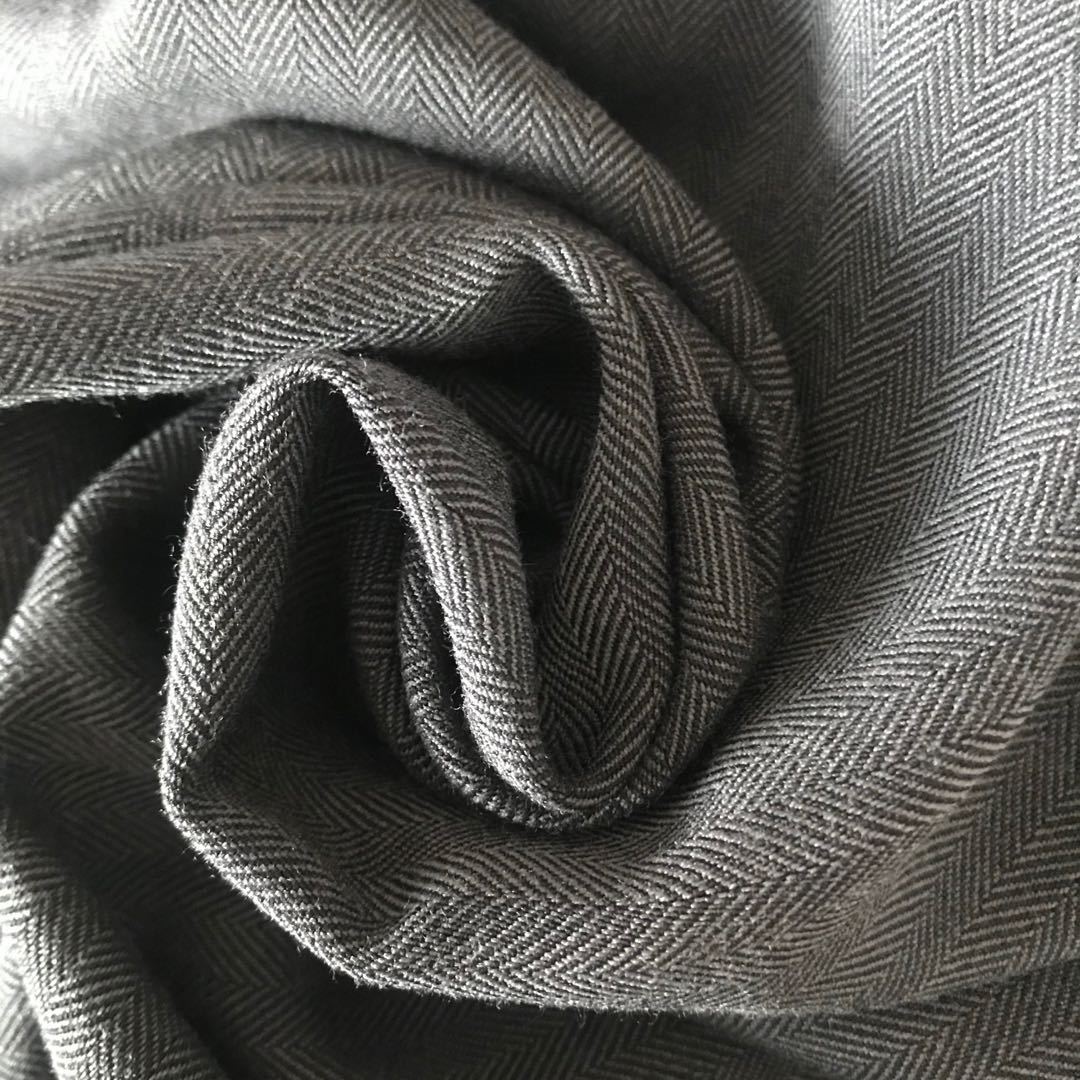 厂家直销 32s/2涤粘交织人字形tr纬弹面料 230g长裤风衣外套布料