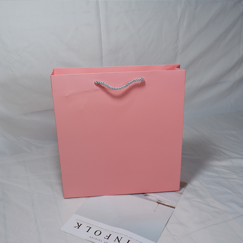 粉色牛皮纸购物礼品袋空白牛皮纸手提包装袋服装手提纸袋定做logo