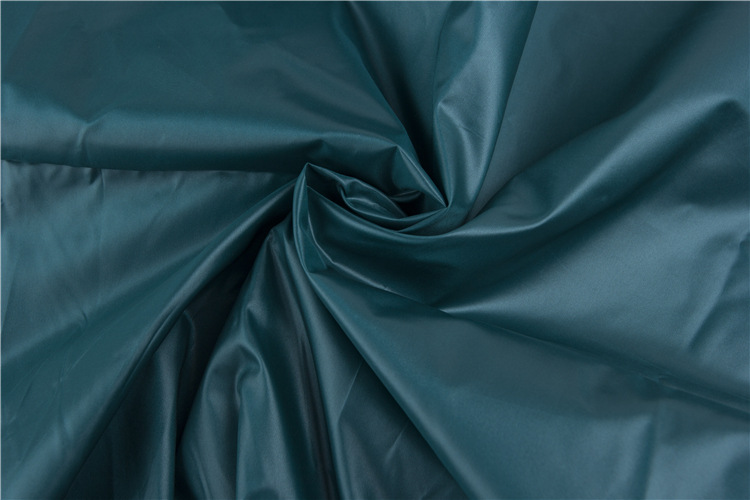 20d圆孔尼龙面料 防晒服时装梭织平纹外套面料 锦纶亮光风衣布料厂家