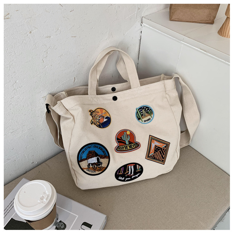 帆布包新款休闲刺绣徽章布标潮流时尚耐磨大容量单肩斜挎女包布包