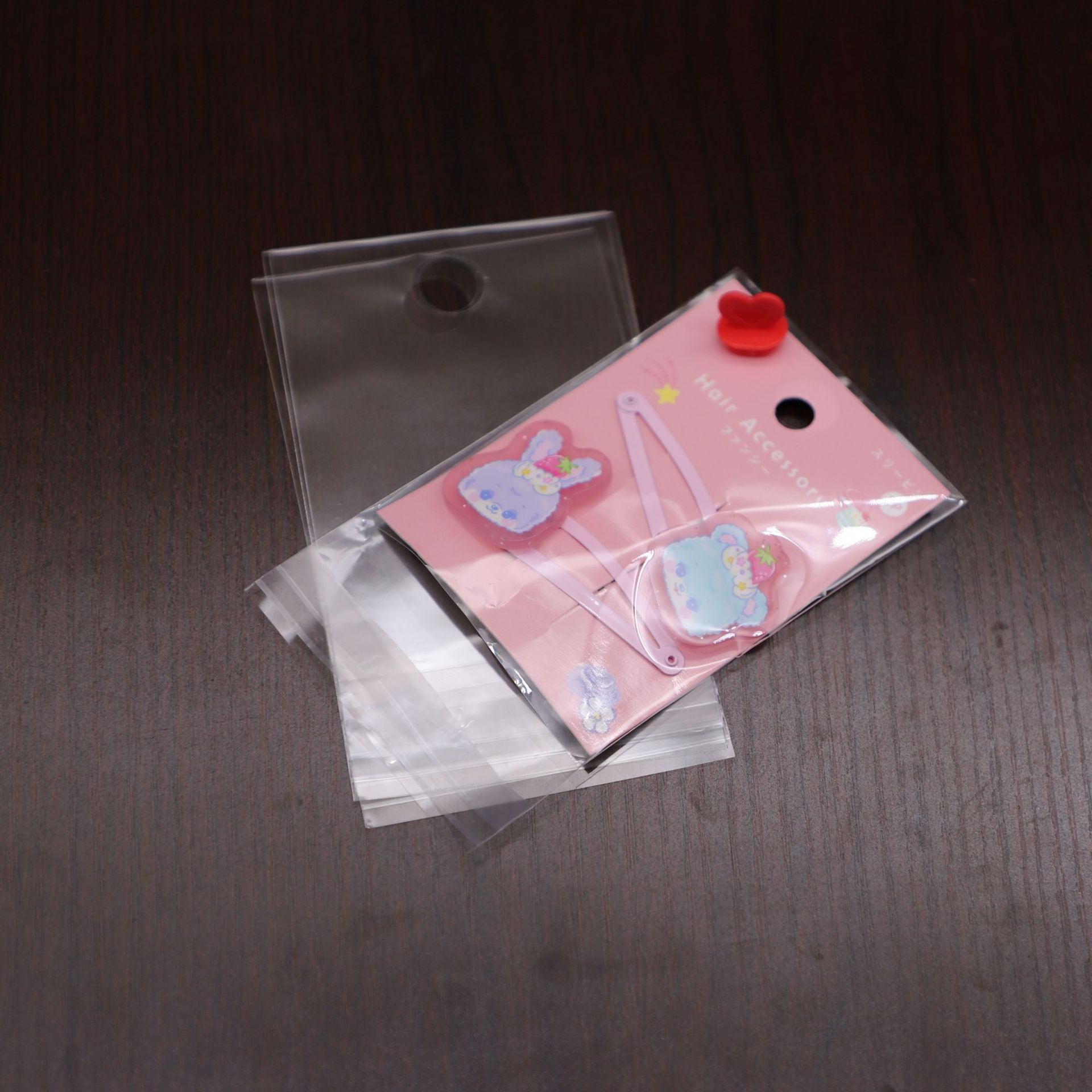 定做透明圆孔飞机孔opp自黏袋现货儿童贴纸放纸卡顶部打挂孔袋子