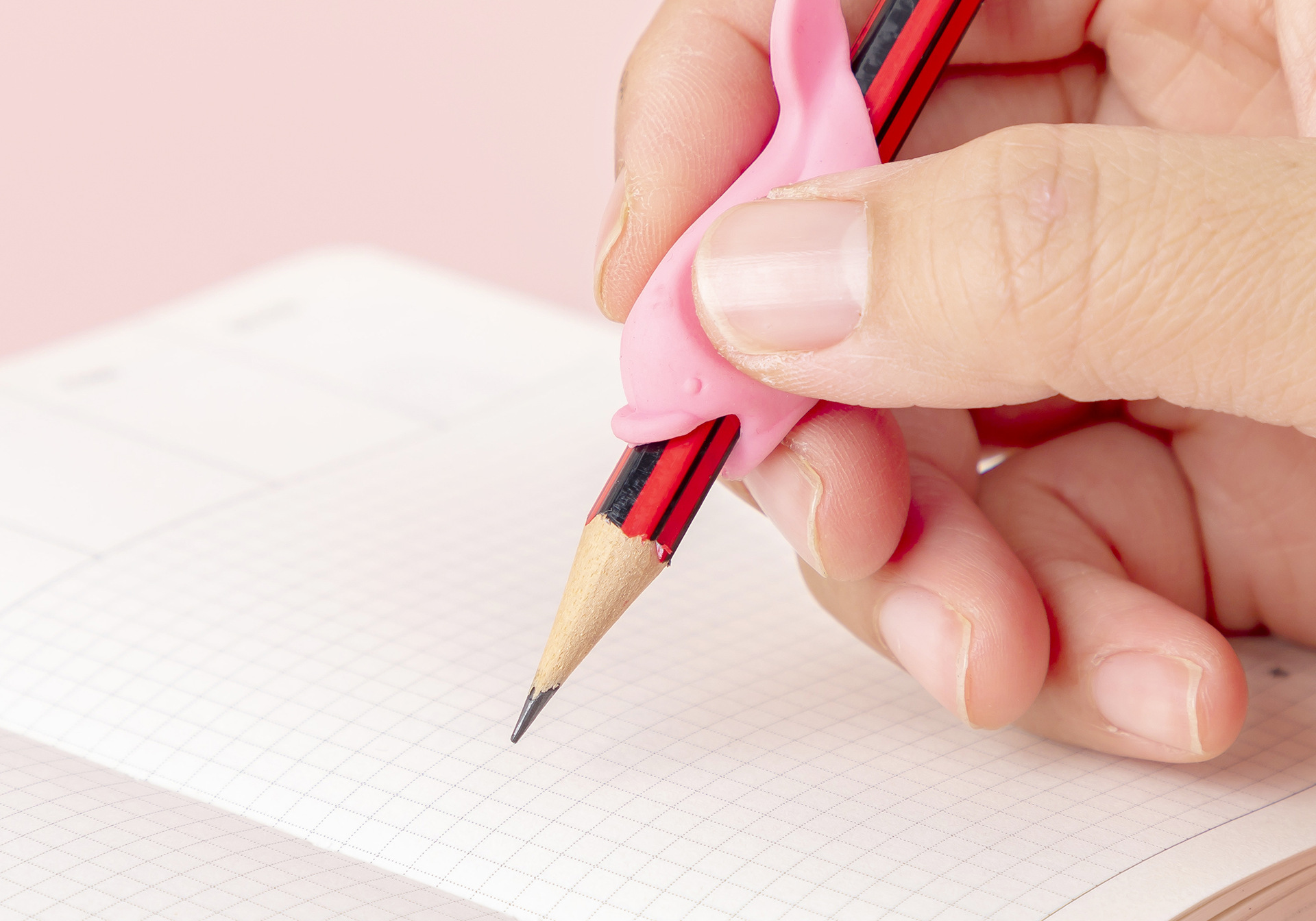 创意卡通软硅胶小海豚儿童写字握笔器学生创意文具批发定做厂家