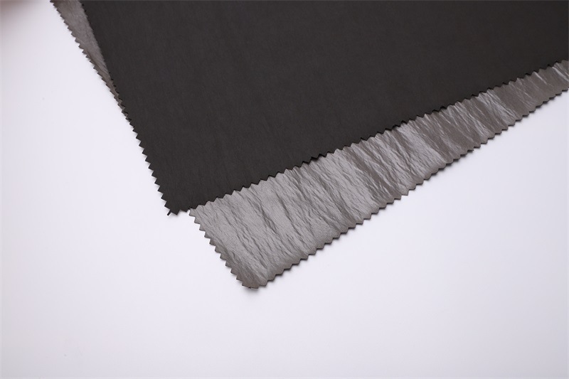 厂家直供无胆防绒尼丝纺 高密油光亮面轻薄羽绒服面料