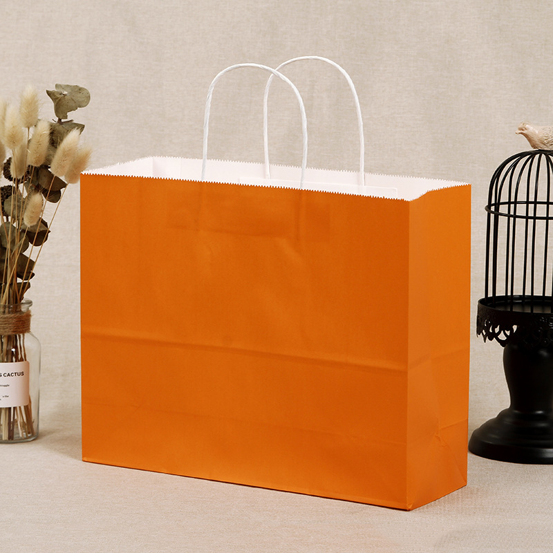 现货牛皮纸袋化妆品橙色手提礼品袋服装购物茶叶包装袋加印logo