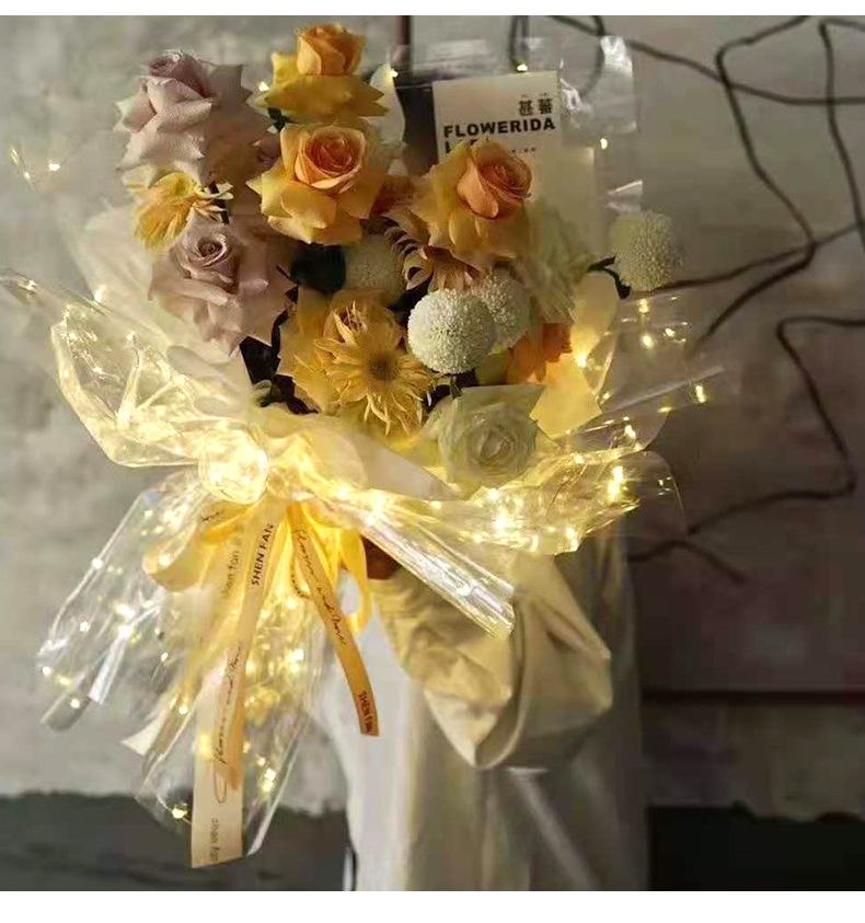 现货批发鲜花包装纸星空发光纸 透明闪光带灯花束包装纸 花店用品