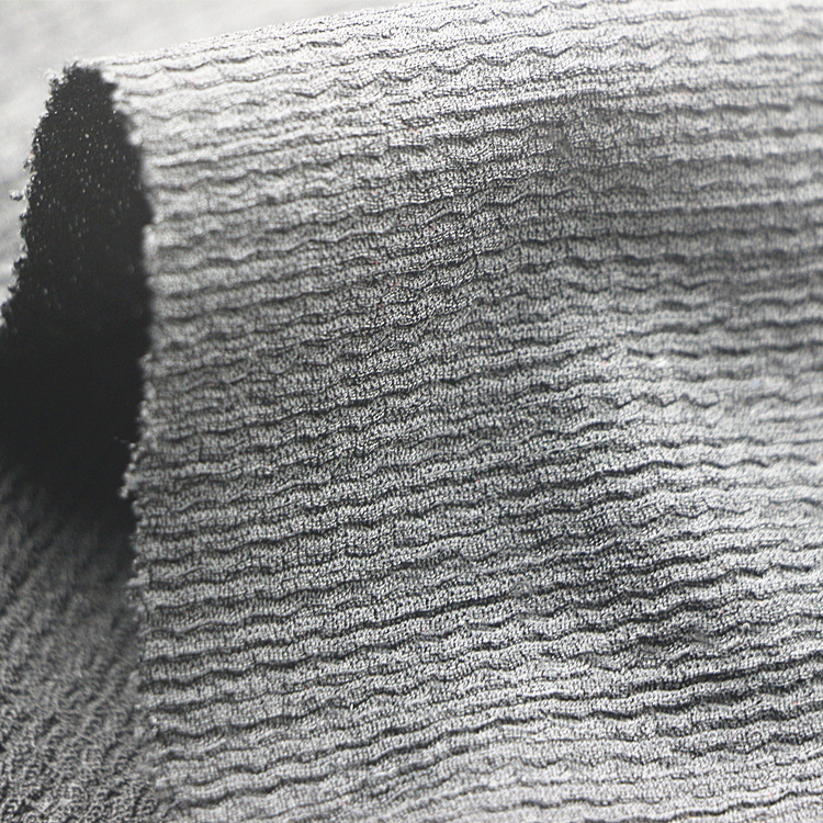 经编涤纶氨纶弹力针织提花凹凸泡泡纱绉布褶皱布时装女装童装面料