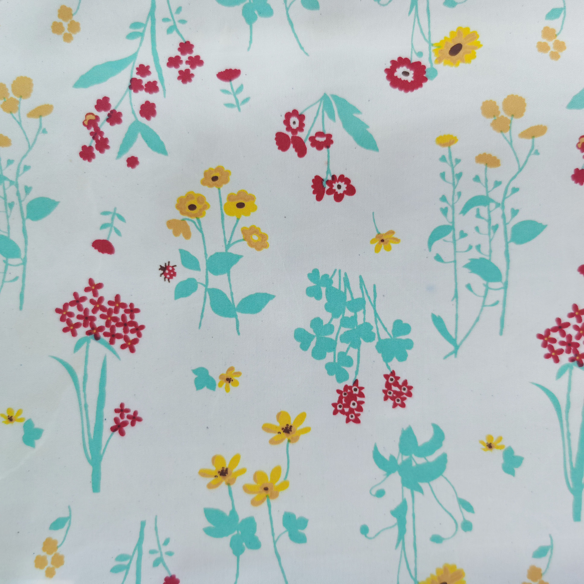 涤纶化纤面料布料环保梅花小碎花印花布桃皮绒面料