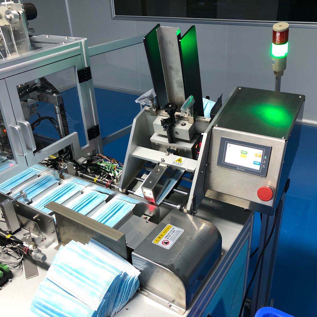 厂家供应平面口罩分页投料机 口罩送片机 kf94鱼形口罩点数分页机