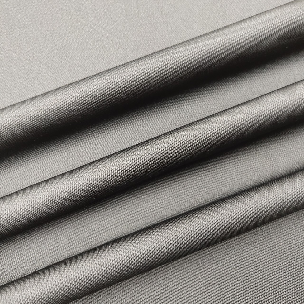 锦涤黑沙经编平布 包边布 特利科特工艺品鞋材箱包手袋复合布料