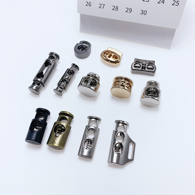 现货金属弹簧扣锌合金穿绳扣止绳扣双孔抽绳扣调节钮扣帽绳卡扣子