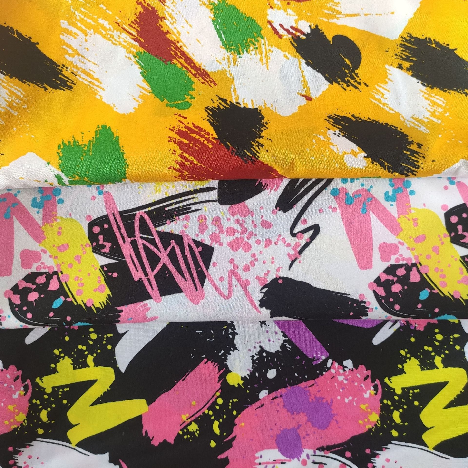 涤纶油漆图案印花布料 个性印花图案 桃皮绒印花面料 沙滩裤印花