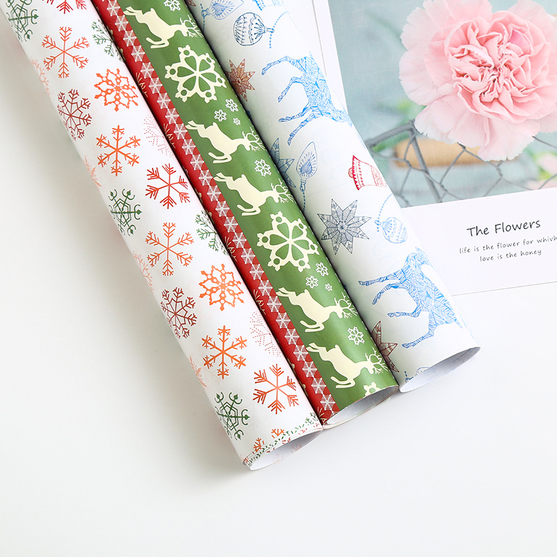 新款圣诞礼品礼物包装纸加厚100g铜版纸圣诞麋鹿雪花鲜花包装纸