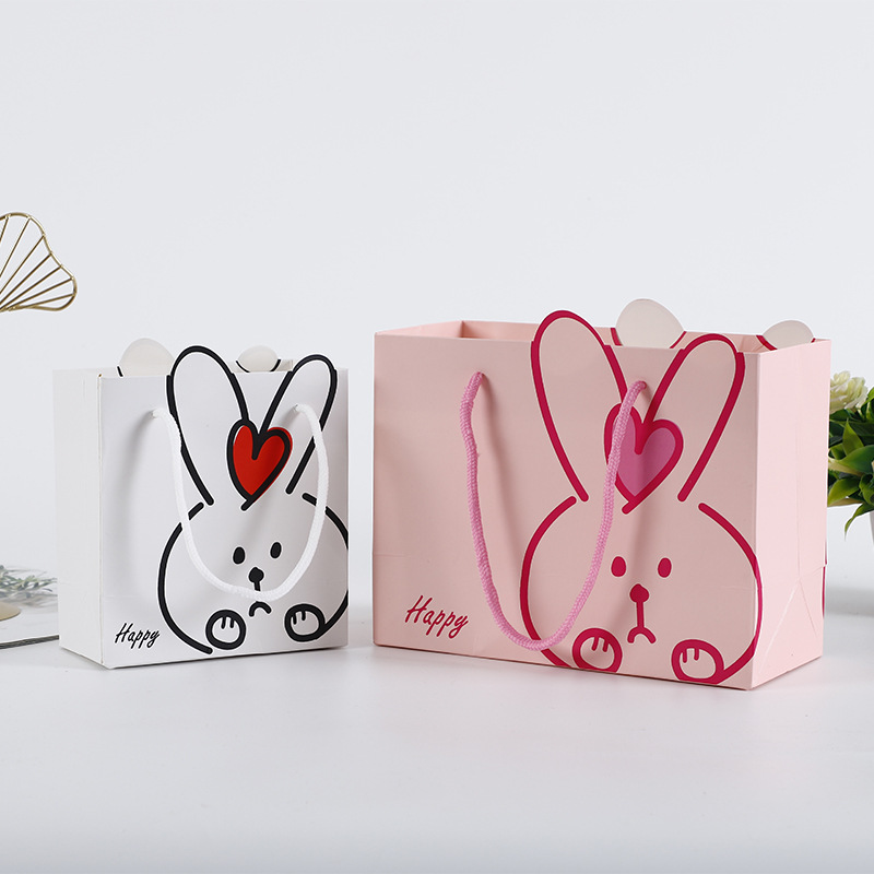 厂家直销礼品纸袋可爱卡通兔子异形手提白卡纸购物袋广告手提袋