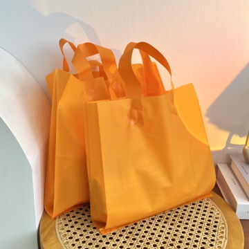 服装店手提袋工厂批发橙色塑料礼品袋加厚女装童装包装袋印字logo