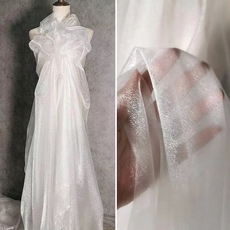 白色雪纱 珠光设计师欧根纱布料 服装礼服婚庆背景花束纱幔面料